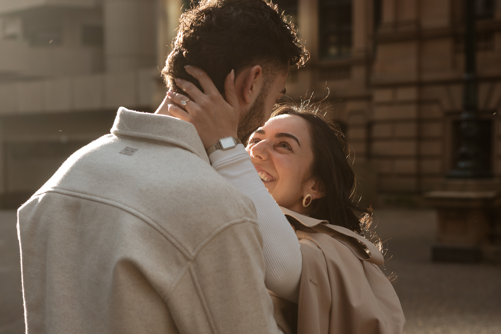Couple laughing, holding hands, and enjoying the sunset walking in Sydney CBD