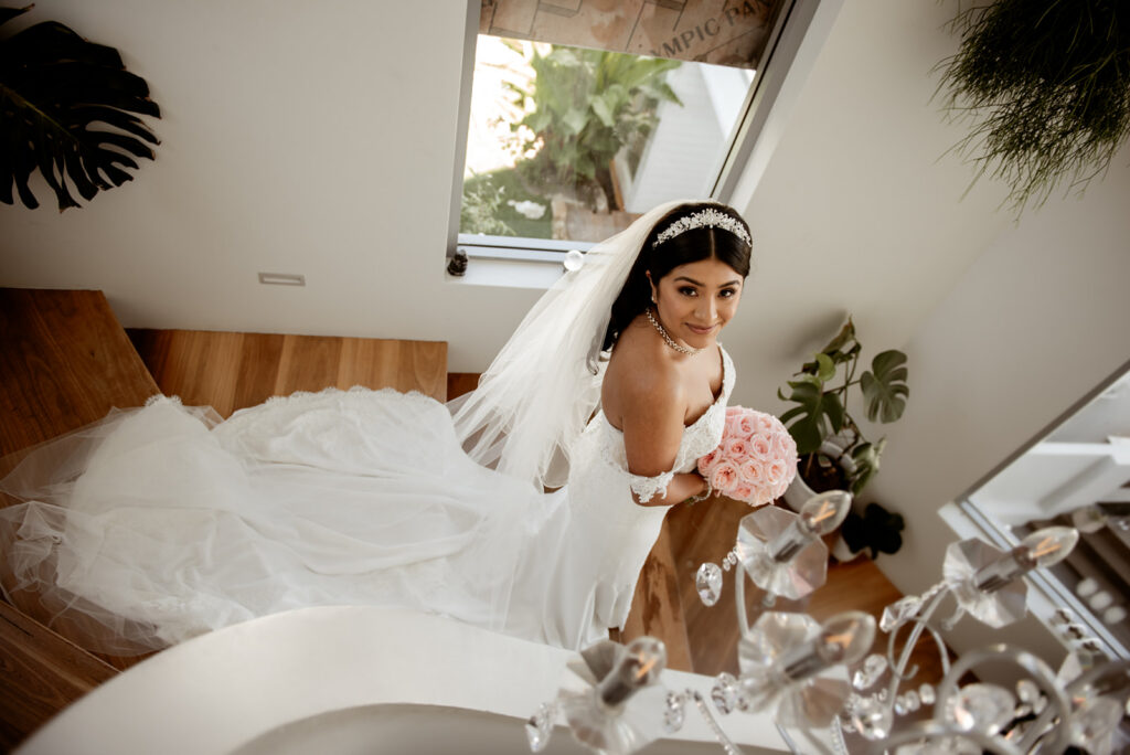 Bride and bridesmaids laughing together during relaxed wedding morning, candid photography by Carolina Morgan Sydney