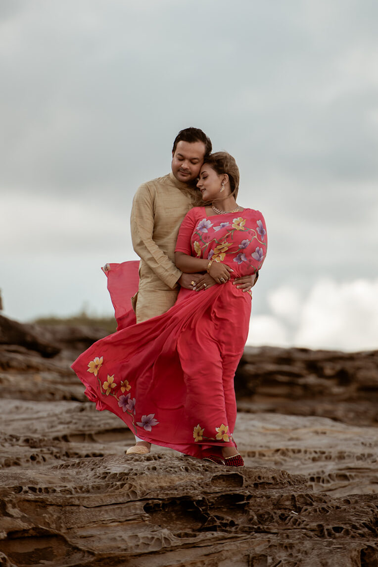 Couple in complementary earthy tones during couples photography session at Sydney beach, Carolina Morgan Photography