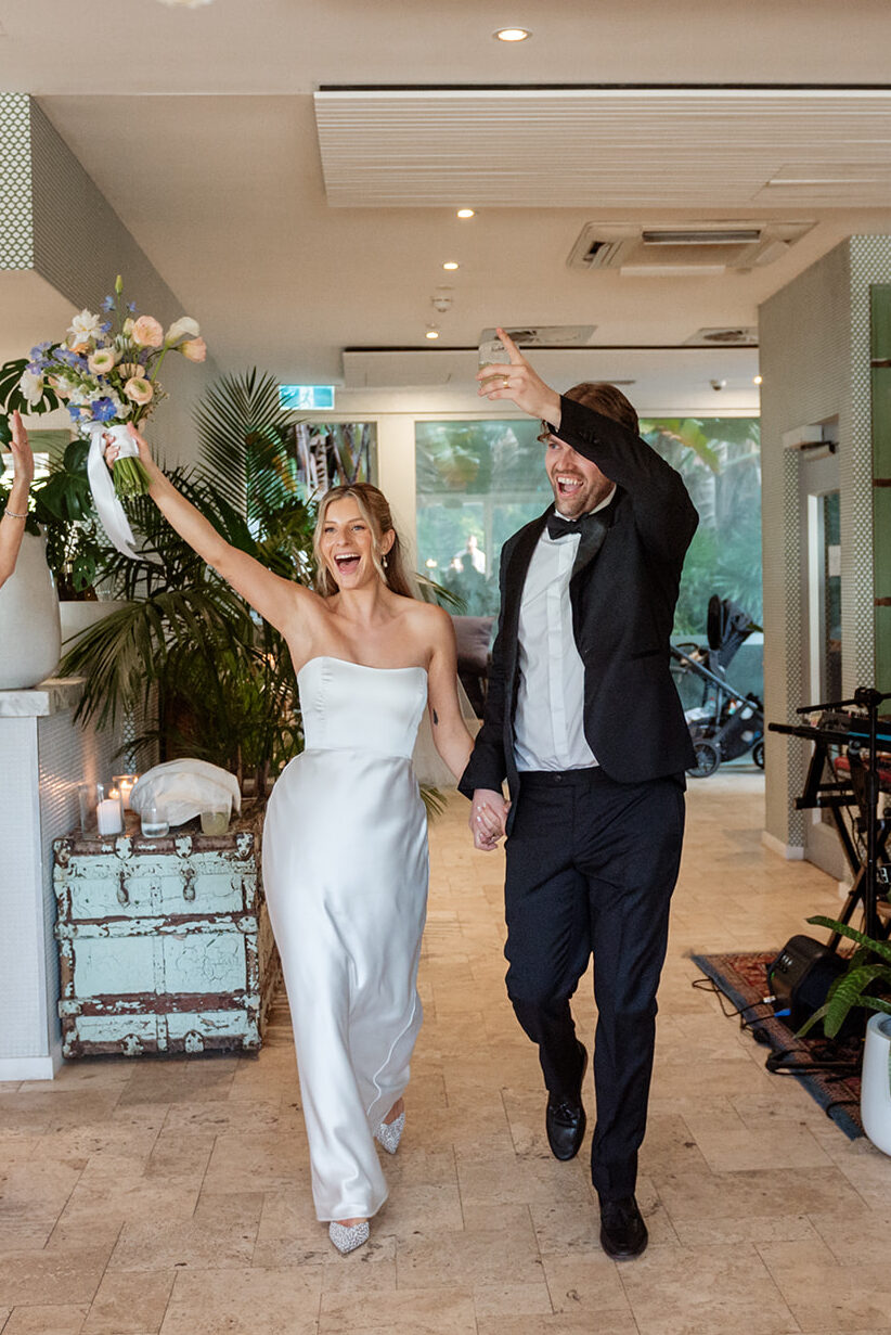 Wedding guests being welcomed at ceremony entrance, candid wedding photography Sydney by Carolina Morgan