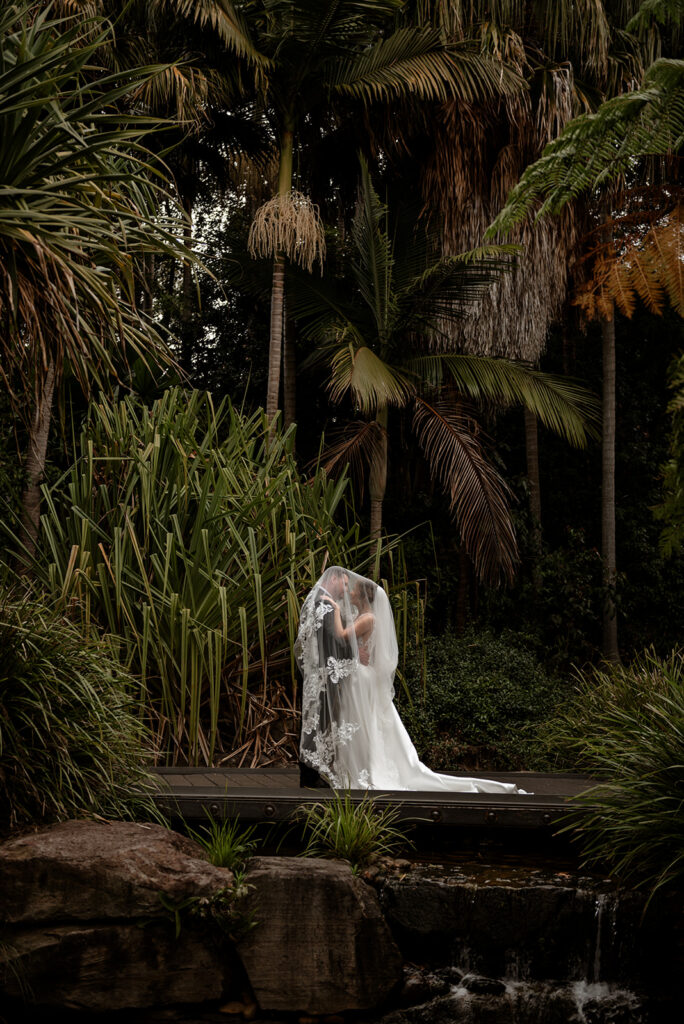 Bride and groom sharing a first look moment before wedding ceremony, candid wedding photography Sydney by Carolina Morgan